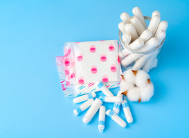 Normal_female-pads-and-tampons-on-blue-paper-background-2023-11-27-05-35-06-utc