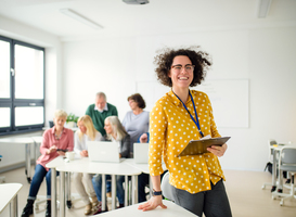 Normal_portrait-of-teacher-with-seniors-attending-compute-2023-11-27-04-56-33-utc