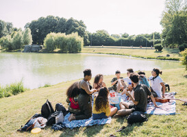 Normal_group-of-friends-relaxing-at-picnic-in-park-2024-07-02-05-27-29-utc