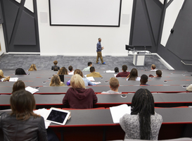 Normal_man-lectures-students-in-lecture-theatre-back-row-2023-11-27-04-54-29-utc