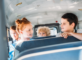 Normal_group-of-happy-little-pupils-riding-on-school-bus-2023-11-27-05-08-41-utc