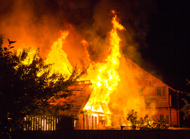 Normal_burning-wooden-house-at-night-bright-orange-flame-2023-11-27-05-13-12-utc