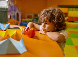 Normal_cute-boy-child-playing-handmade-origami-paper-boat-2024-02-27-03-48-25-utc