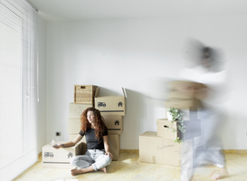 Normal_young-woman-sitting-in-new-home-with-glass-of-red-2023-11-27-05-35-44-utc