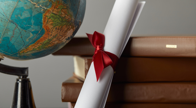 Carousel_brown-books-globe-and-diploma-with-red-ribbon-on-2023-11-27-05-28-59-utc