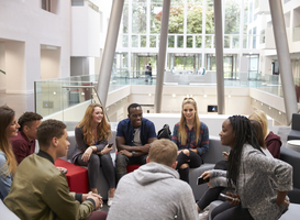 Normal_students-sitting-in-the-foyer-of-modern-university-2024-10-19-13-45-06-utc