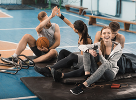 Normal_smiling-young-sporty-people-sitting-on-mats-and-ta-2024-11-17-15-29-23-utc