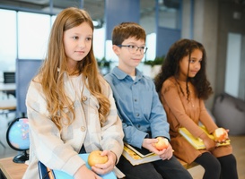 Normal_multiracial-schoolchildren-having-lunch-at-the-des-2023-12-07-05-31-45-utc