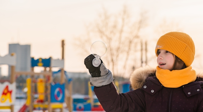 Carousel_cute-little-girl-blows-soap-bubbles-in-winter-2023-11-27-04-48-50-utc